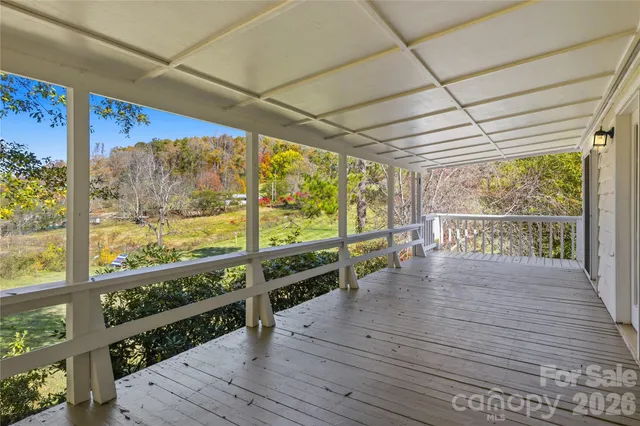 a view of a balcony with wooden floor