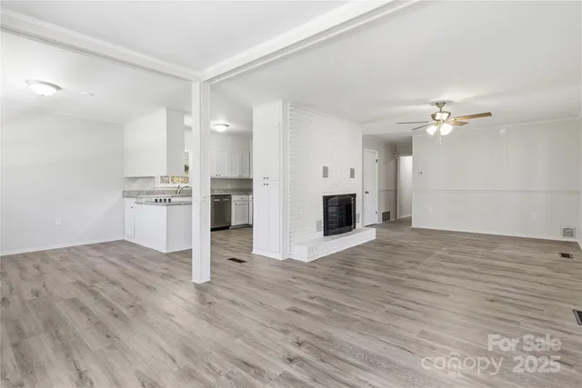 a view of a kitchen with a stove cabinets and wooden floor