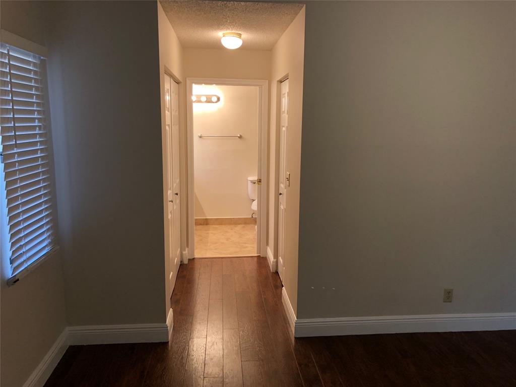 9488 Majestic Way Boynton Beach, FL 33437 - Photo 15 of 15 a view of a hallway with wooden floor