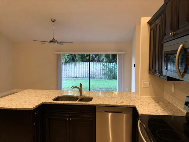 a kitchen with a sink and a window