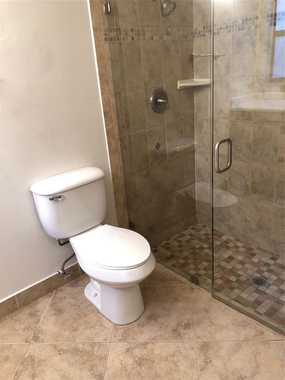 9488 Majestic Way Boynton Beach, FL 33437 - Photo 8 of 15 a bathroom with a toilet and a shower