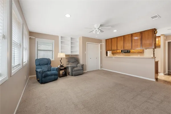 a kitchen with stainless steel appliances a refrigerator and wooden floor