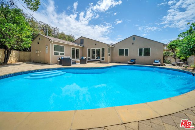 a front view of house with yard and seating area
