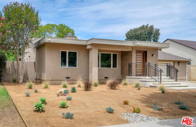 a front view of a house with a patio