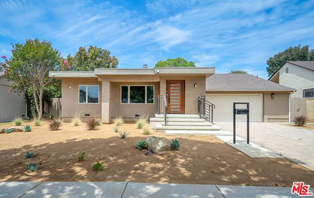 a front view of a house with a lounge chair