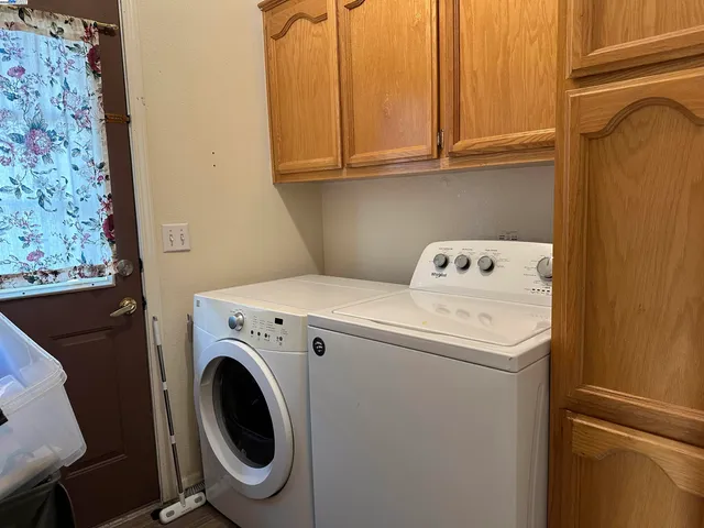 a utility room with dryer and washer