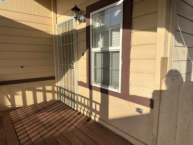 a view of a balcony with wooden floor