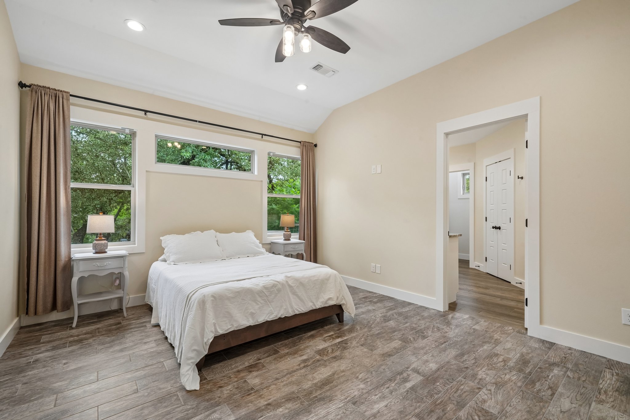 190 Magnolia Meadow Spring Branch, TX 78070 - Photo 10 of 29 Sun-drenched interiors meet rich wood-look flooring, creating a serene personal retreat.