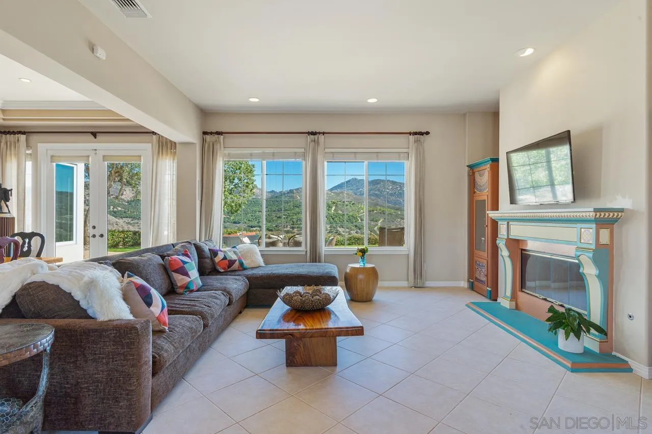 17065 Butterfield Trail Poway, CA 92064 - Photo 15 of 71 a living room with furniture and a fireplace