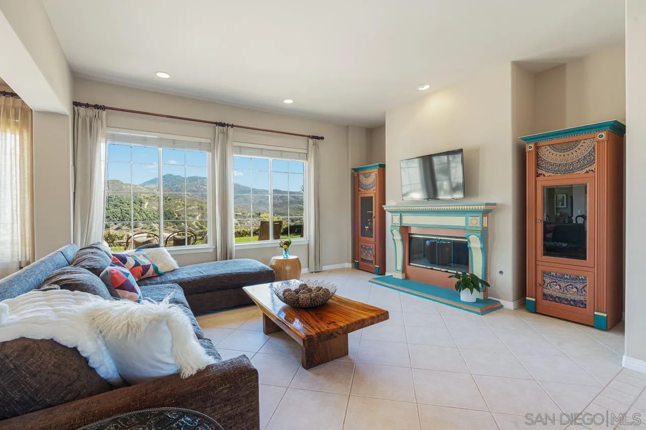 17065 Butterfield Trail Poway, CA 92064 - Photo 16 of 71 a living room with furniture and a fireplace