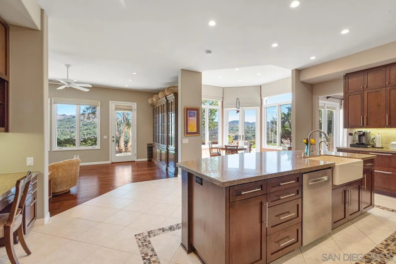 17065 Butterfield Trail Poway, CA 92064 - Photo 19 of 71 a dining hall with stainless steel appliances granite countertop a lot of counter space and a sink