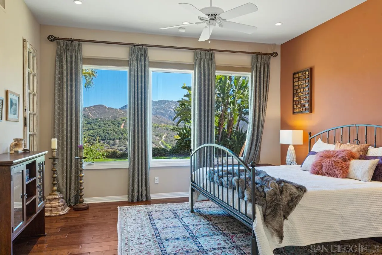 17065 Butterfield Trail Poway, CA 92064 - Photo 32 of 71 a bedroom with a bed and a window