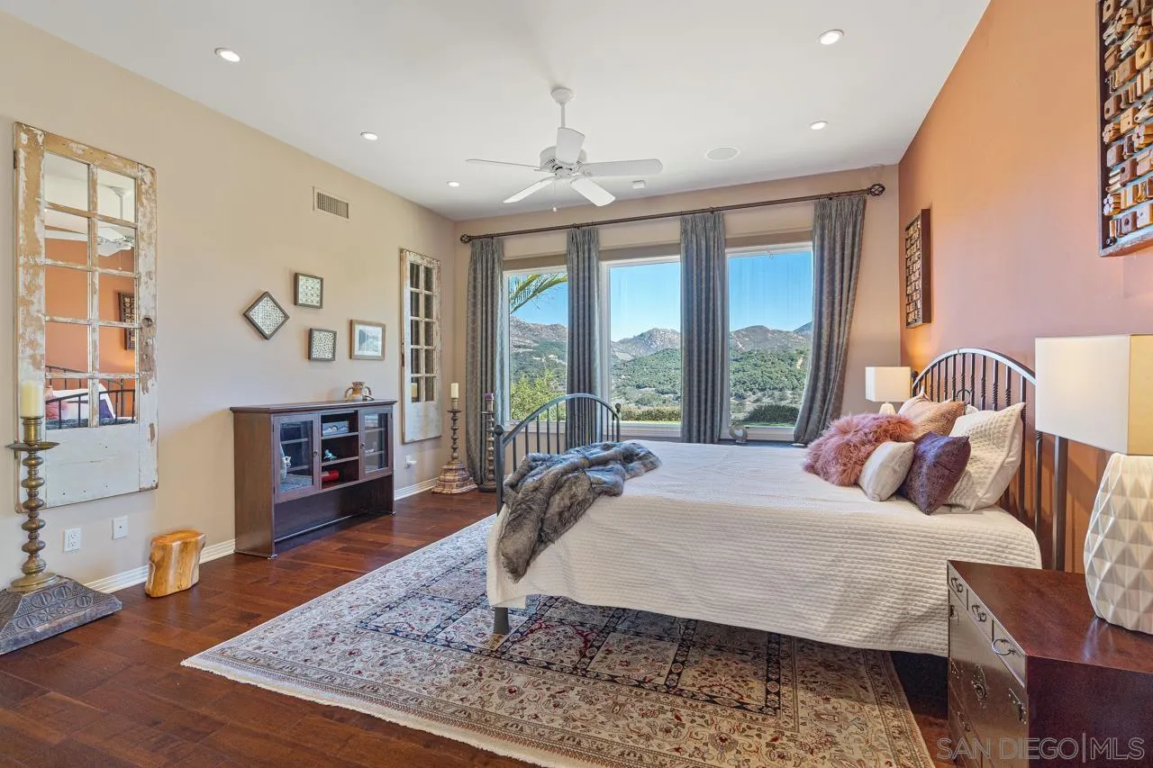 17065 Butterfield Trail Poway, CA 92064 - Photo 34 of 71 a bed room with a bed and wooden floor