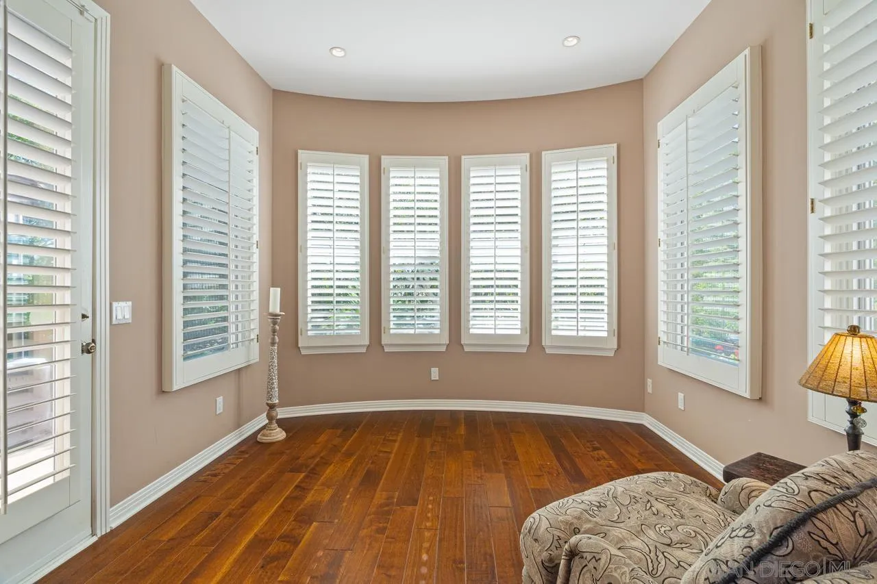 17065 Butterfield Trail Poway, CA 92064 - Photo 36 of 71 a spacious bedroom with a bed and a large window with outer view