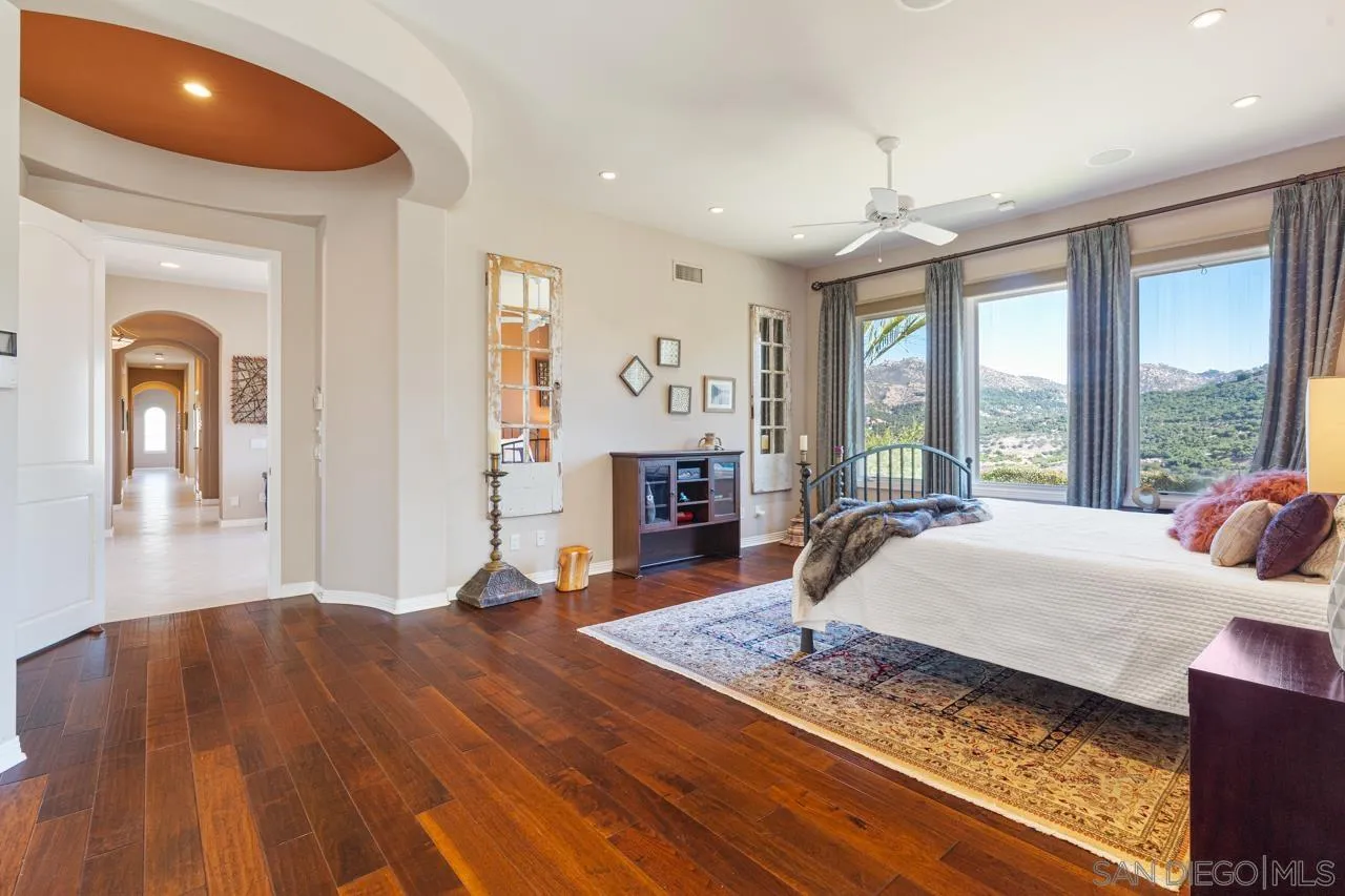 17065 Butterfield Trail Poway, CA 92064 - Photo 37 of 71 a bed room with a bed and a large window