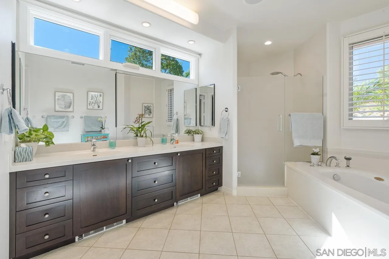 17065 Butterfield Trail Poway, CA 92064 - Photo 38 of 71 a spacious bathroom with a tub sink and mirror