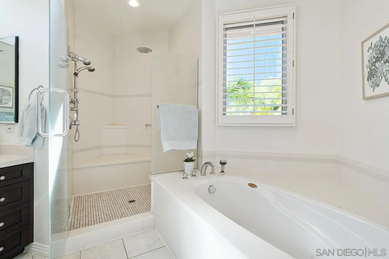 17065 Butterfield Trail Poway, CA 92064 - Photo 40 of 71 a bathroom with a bathtub and shower