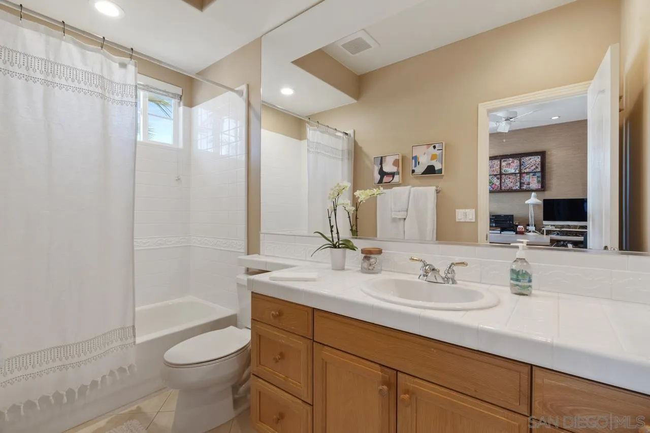 17065 Butterfield Trail Poway, CA 92064 - Photo 48 of 71 a bathroom with a sink a toilet and shower