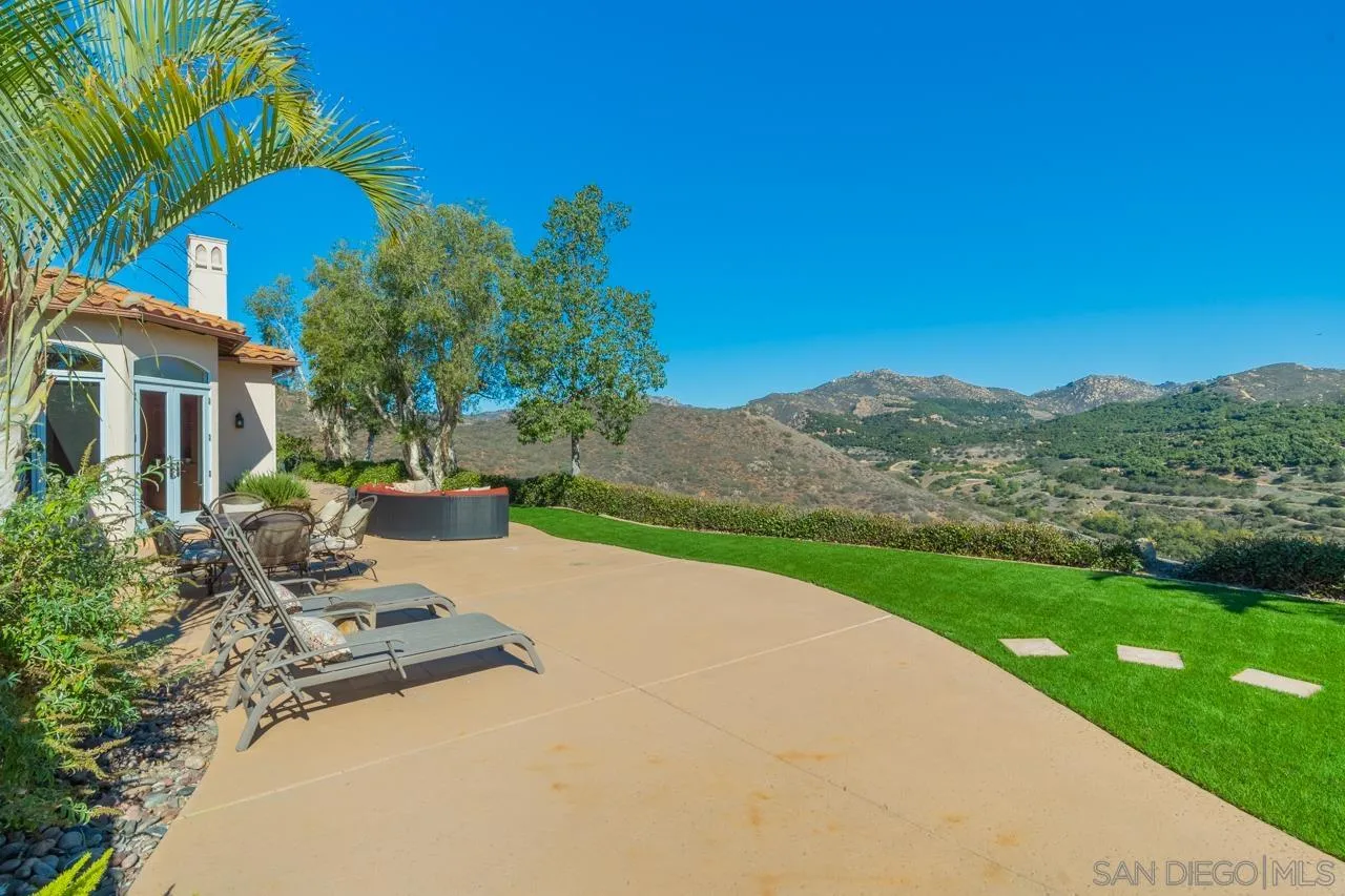 17065 Butterfield Trail Poway, CA 92064 - Photo 51 of 71 a view of a patio with a table and chairs