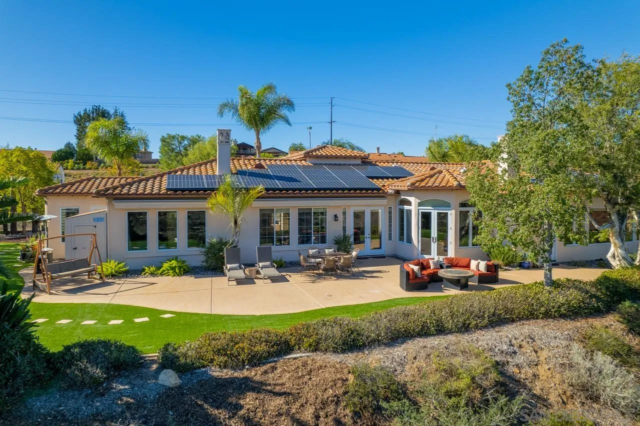 17065 Butterfield Trail Poway, CA 92064 - Photo 58 of 71 a front view of a house with garden and sitting area