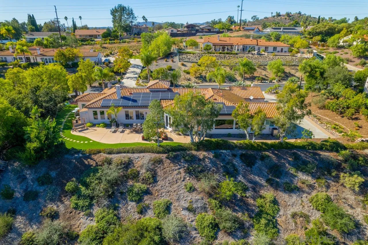 17065 Butterfield Trail Poway, CA 92064 - Photo 59 of 71 an aerial view of residential houses with outdoor space and parking