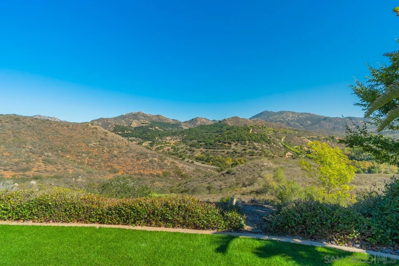 17065 Butterfield Trail Poway, CA 92064 - Photo 71 of 71 a view of a lush green field with mountains in the background