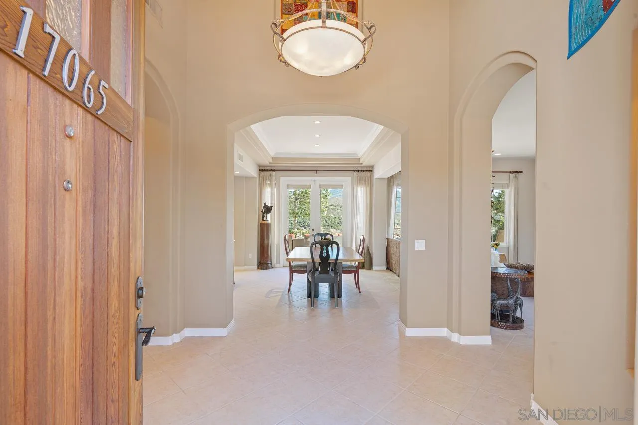 17065 Butterfield Trail Poway, CA 92064 - Photo 9 of 71 a dining room with furniture and a chandelier