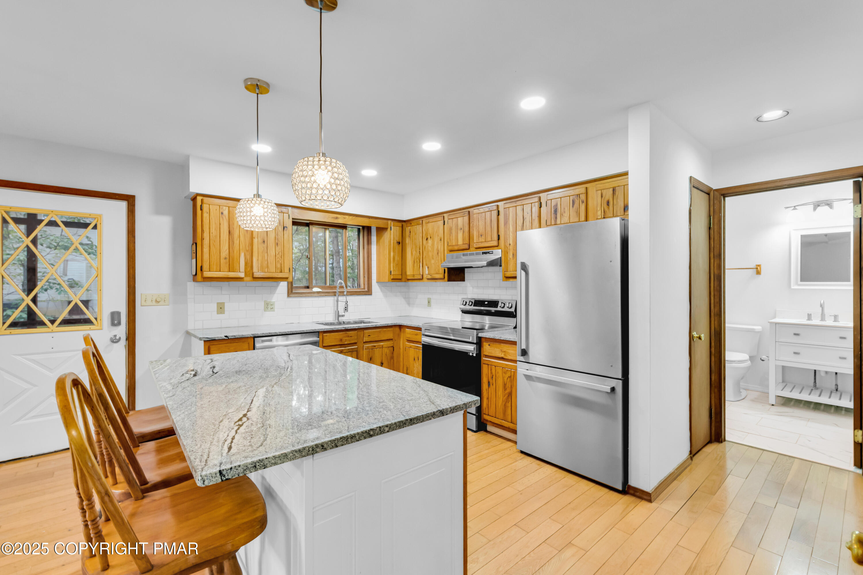 106 Carnforth Drive Bushkill, PA 18324 - Photo 11 of 73 a kitchen with granite countertop cabinets and stainless steel appliances