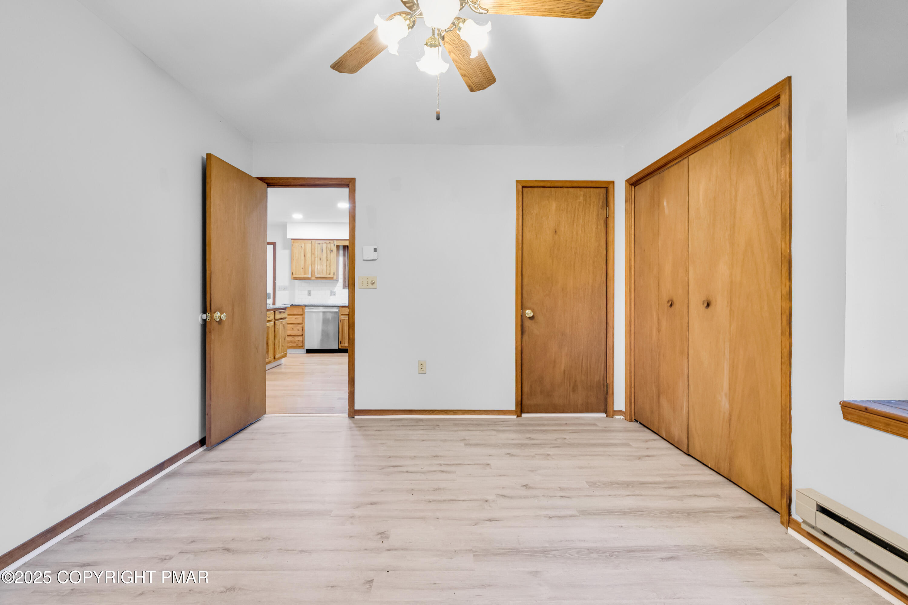 106 Carnforth Drive Bushkill, PA 18324 - Photo 14 of 73 a view of an empty room with wooden floor and a bathroom
