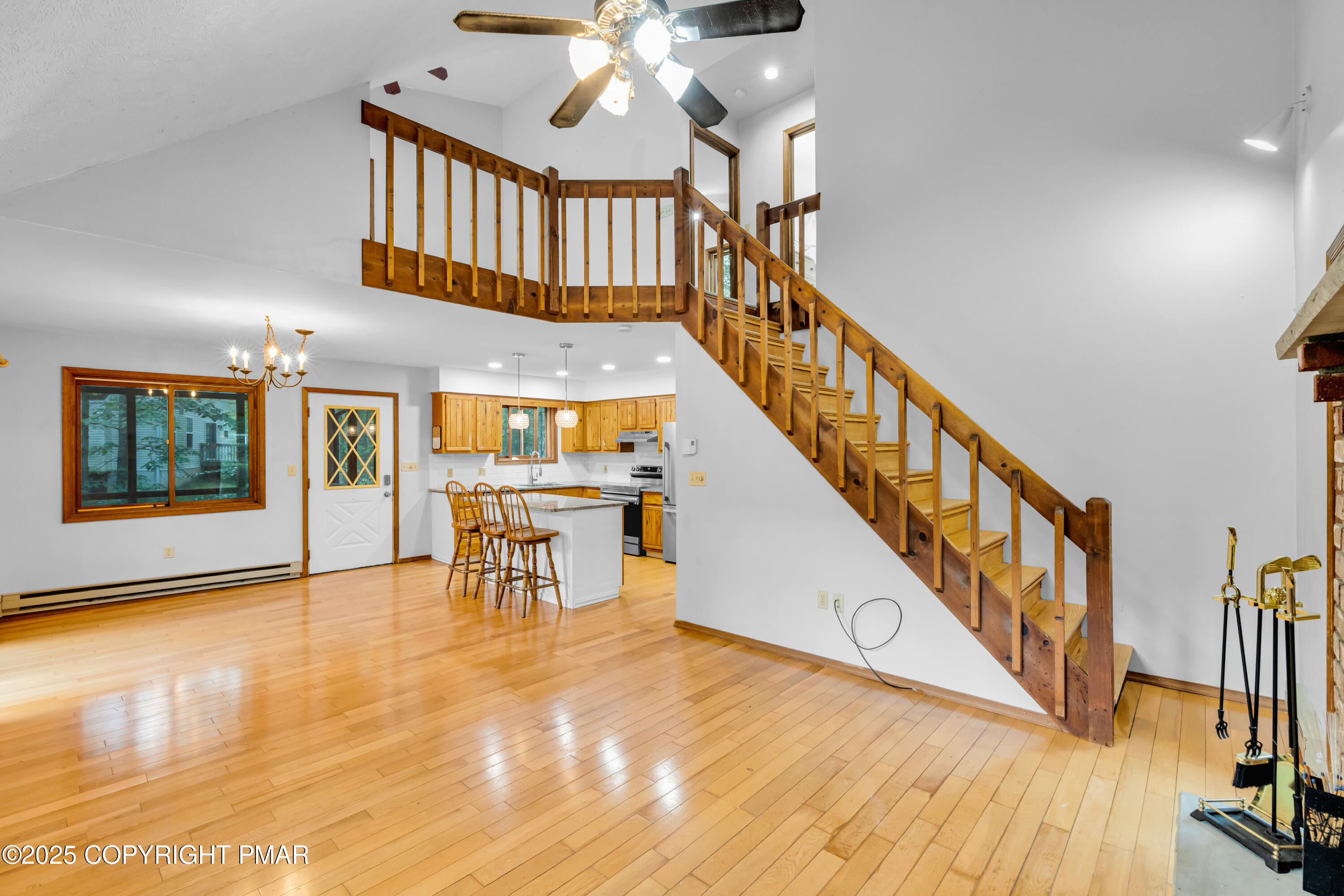 106 Carnforth Drive Bushkill, PA 18324 - Photo 20 of 73 a view of interior of a house with wooden floor windows and a fireplace