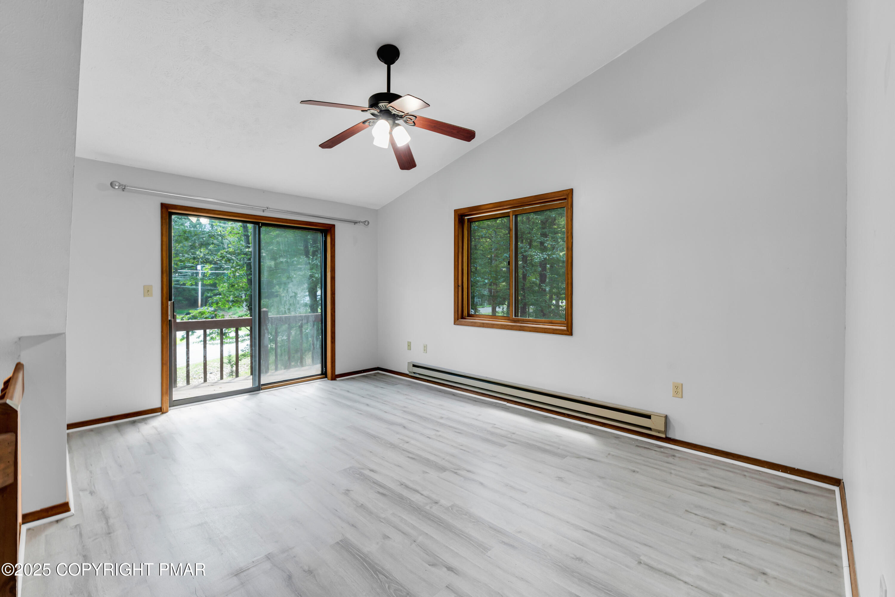 106 Carnforth Drive Bushkill, PA 18324 - Photo 24 of 73 a view of an empty room with wooden floor and a window