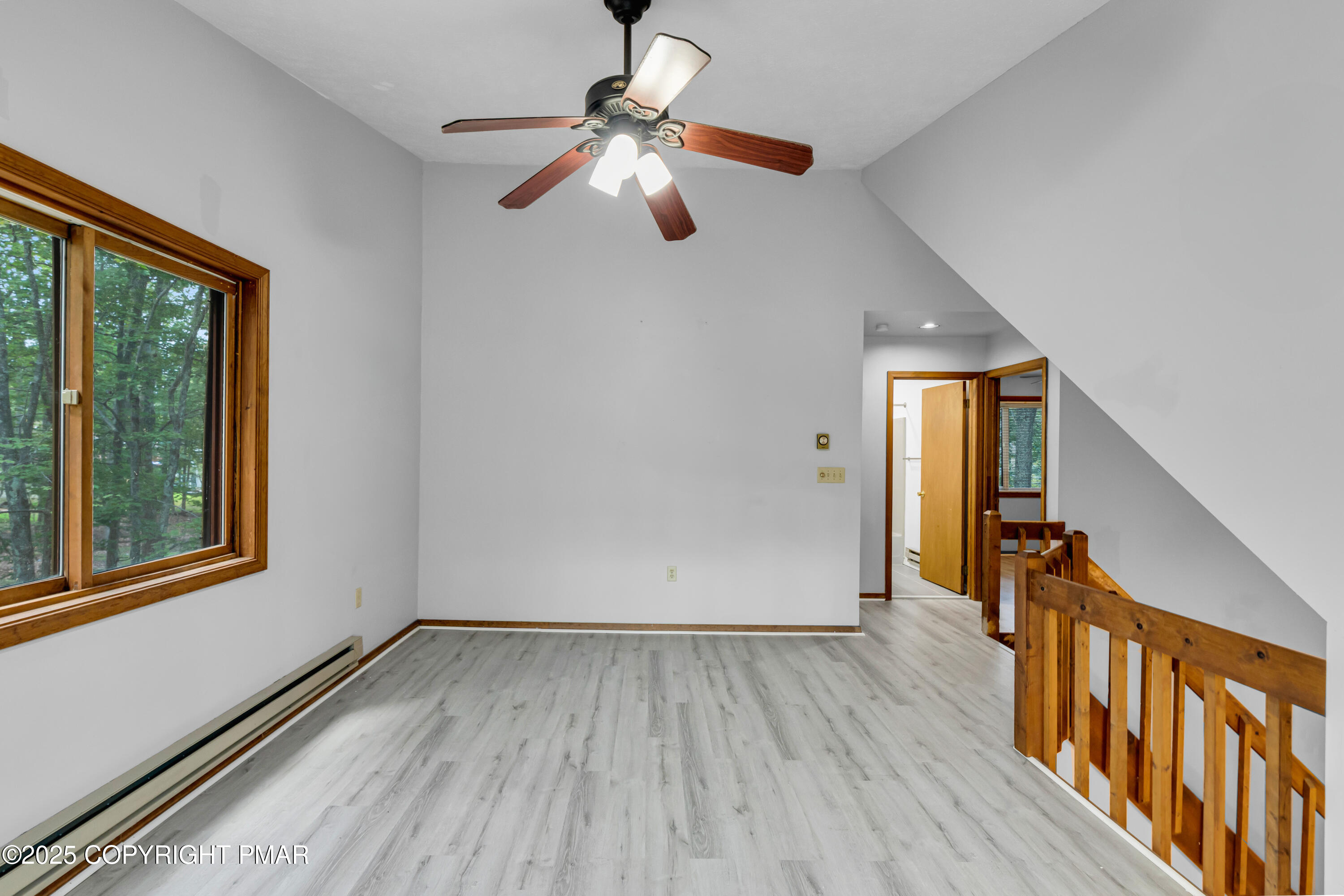 106 Carnforth Drive Bushkill, PA 18324 - Photo 26 of 73 a view of an empty room with wooden floor and a window