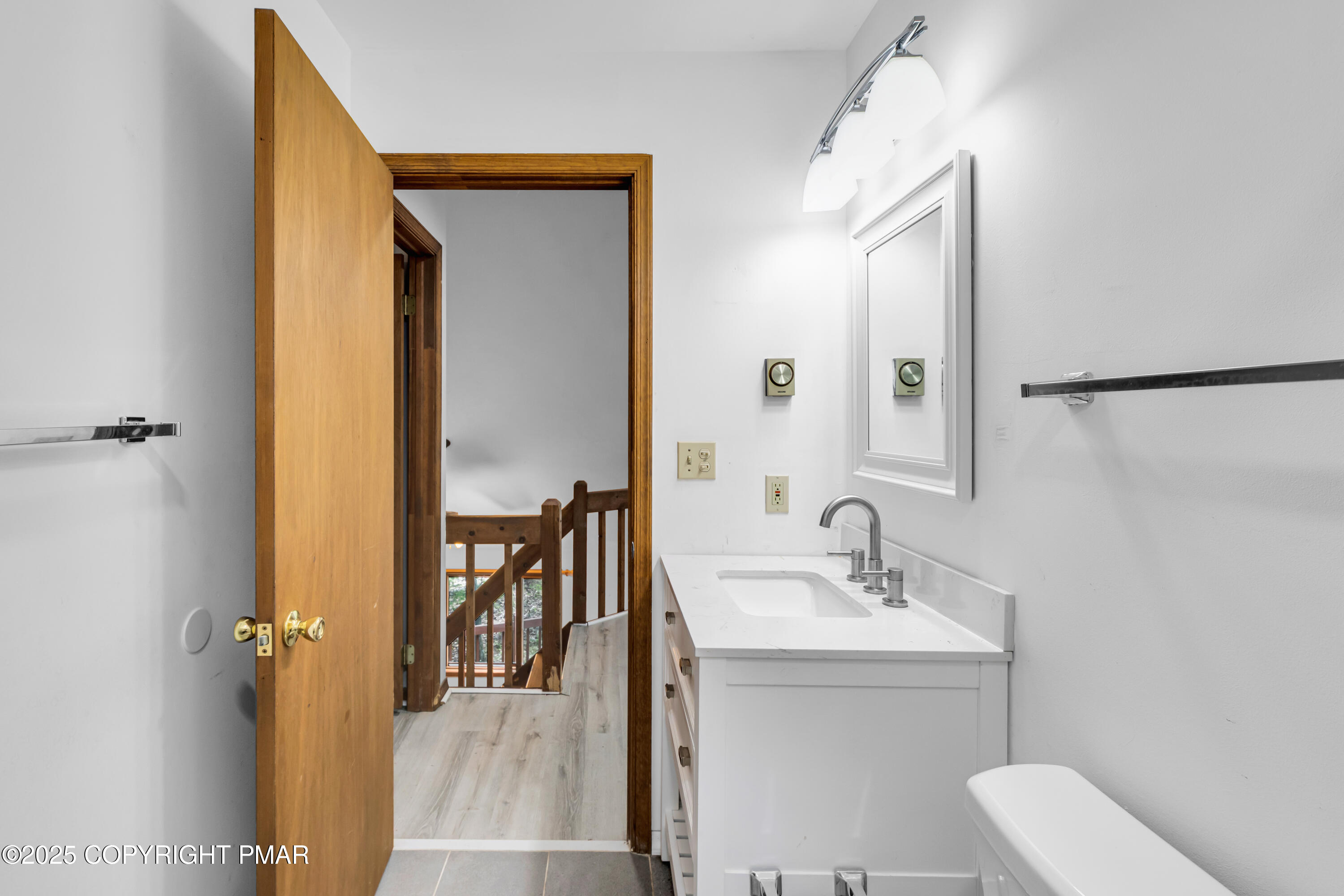 106 Carnforth Drive Bushkill, PA 18324 - Photo 31 of 73 a bathroom with a toilet a sink and mirror