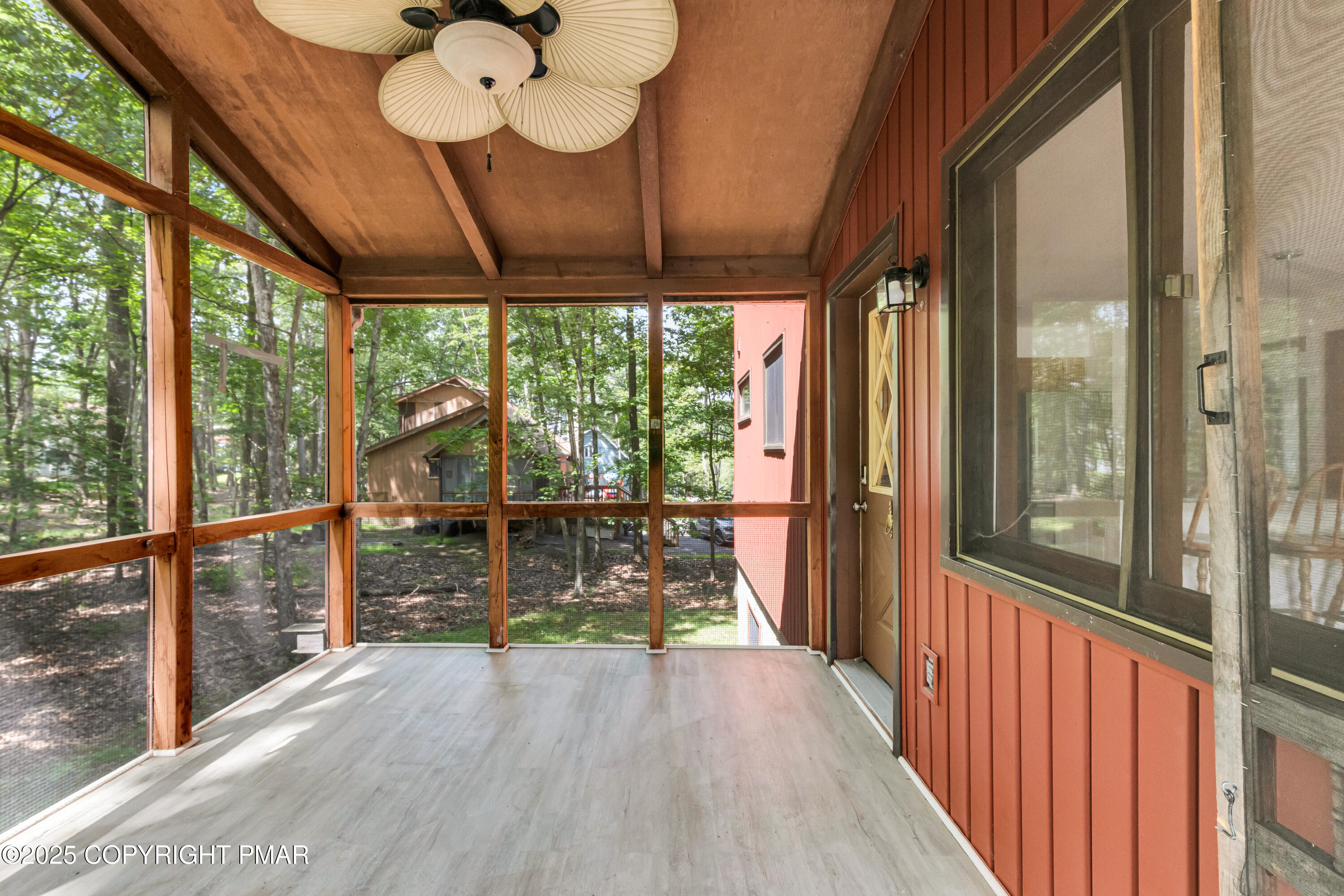 106 Carnforth Drive Bushkill, PA 18324 - Photo 5 of 73 a view of a porch with wooden floor and stairs