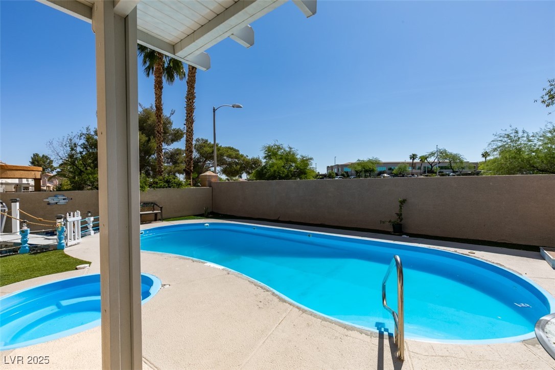 6 High Sierra Henderson, NV 89074 - Photo 49 of 56 View of pool featuring a fenced backyard and a patio area
