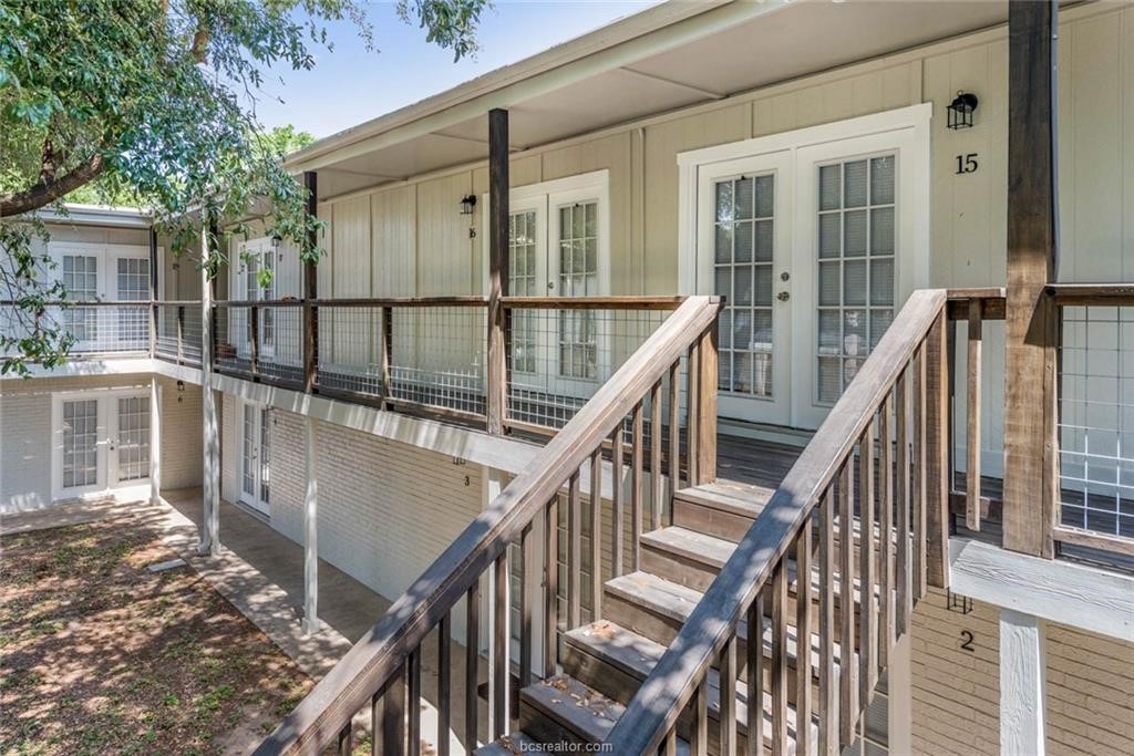 3900 Old College Road, Unit 33 Bryan, TX 77801 - Photo 9 of 10 a view of a balcony with wooden floor and fence and a porch