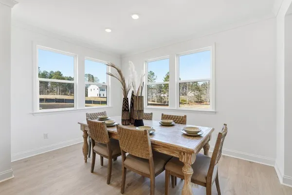 a spacious bedroom with a bed a couch and a window