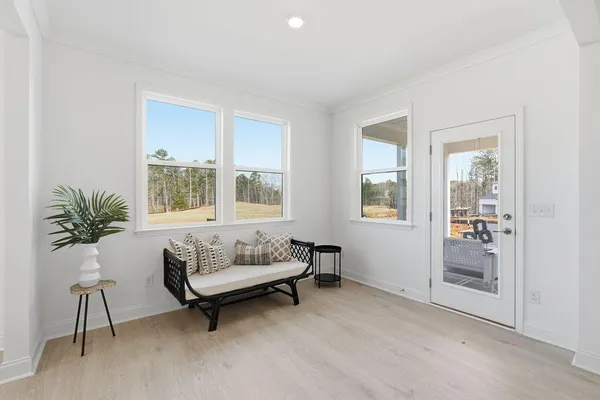 a roof deck with table and chairs potted plants
