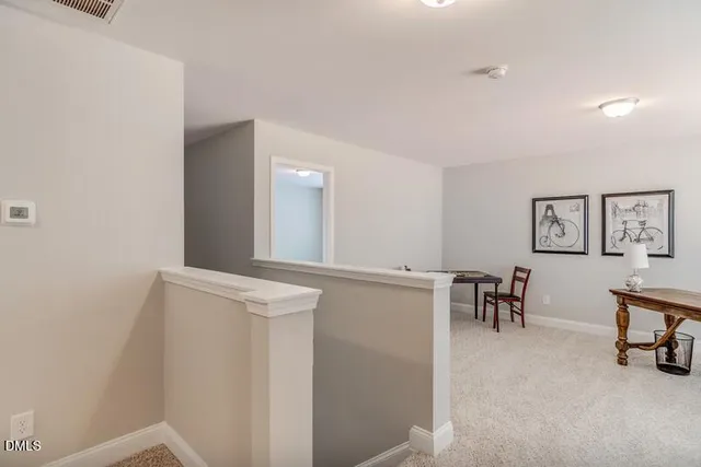 a view of work space with wooden floor and furniture