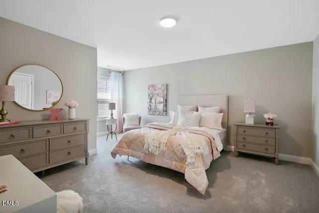 a bed room with a bed and a dresser