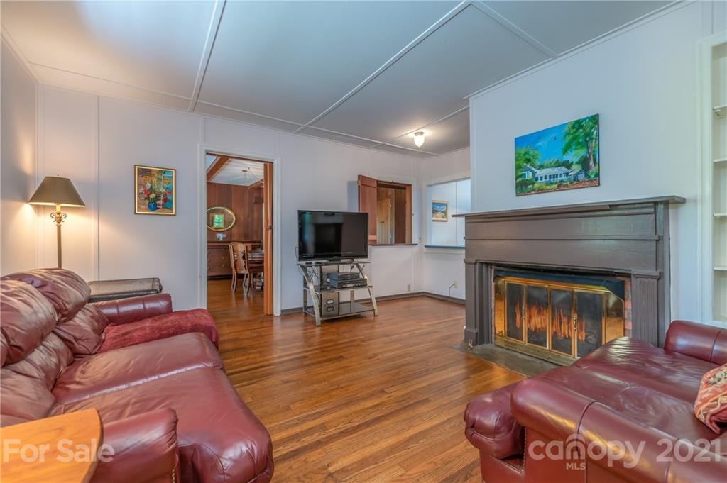 75 Hidden Hill Road Tryon, NC 28782 - Photo 11 of 36 a living room with furniture and a fireplace