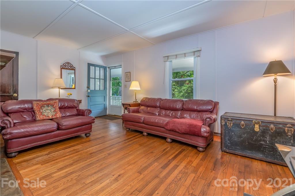 75 Hidden Hill Road Tryon, NC 28782 - Photo 12 of 36 a living room with furniture and a wooden floor