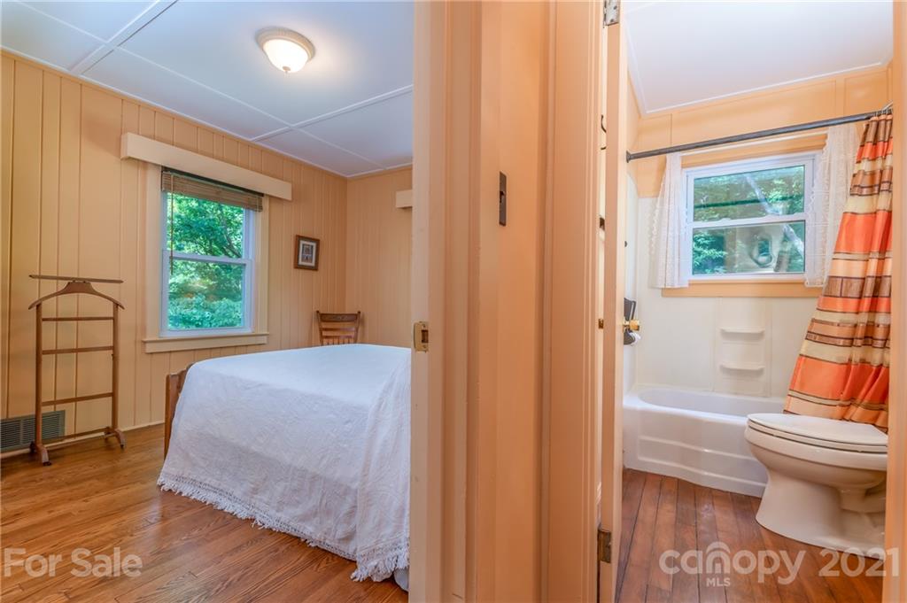75 Hidden Hill Road Tryon, NC 28782 - Photo 17 of 36 a bedroom with a bed and a window