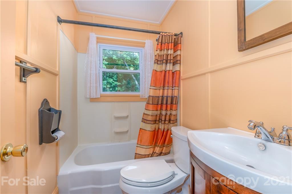 75 Hidden Hill Road Tryon, NC 28782 - Photo 18 of 36 a bathroom with a sink toilet and shower