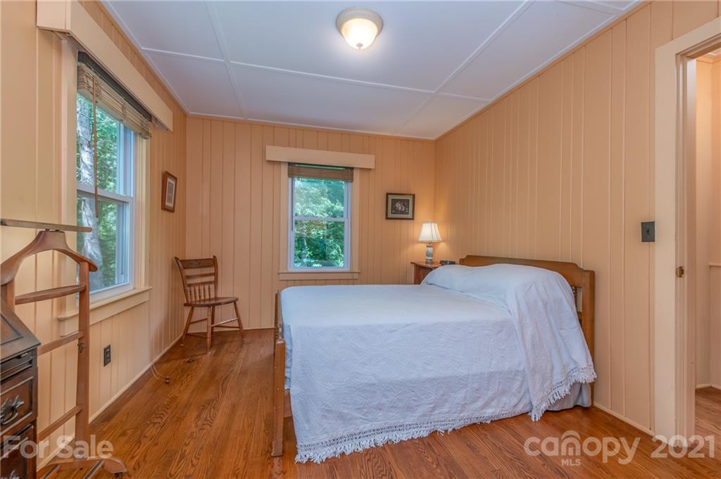 75 Hidden Hill Road Tryon, NC 28782 - Photo 19 of 36 a bedroom with a bed and a window