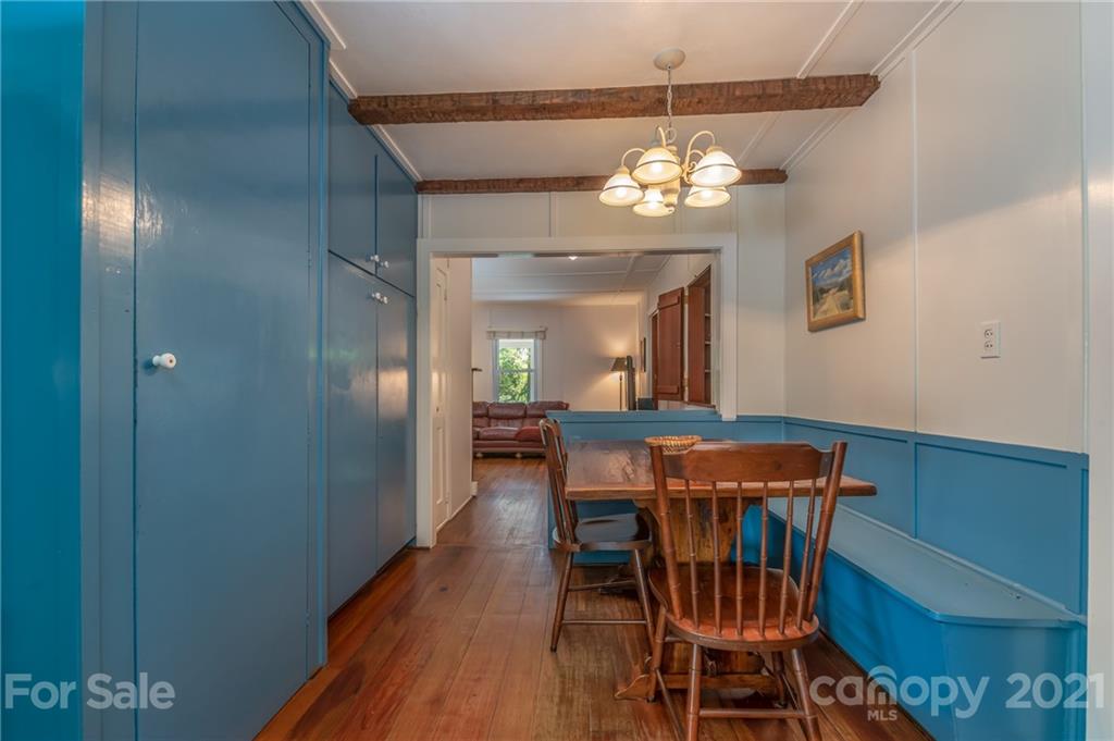 75 Hidden Hill Road Tryon, NC 28782 - Photo 21 of 36 a view of a dining room with furniture and chandelier