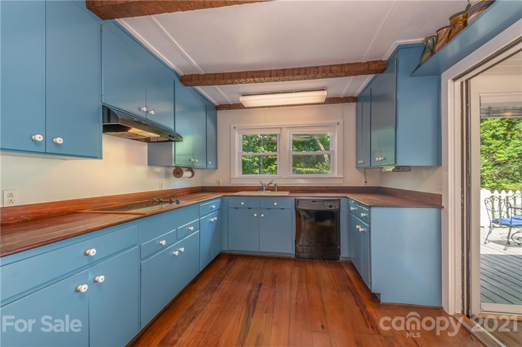 75 Hidden Hill Road Tryon, NC 28782 - Photo 22 of 36 a kitchen with stainless steel appliances granite countertop a stove a sink and a refrigerator