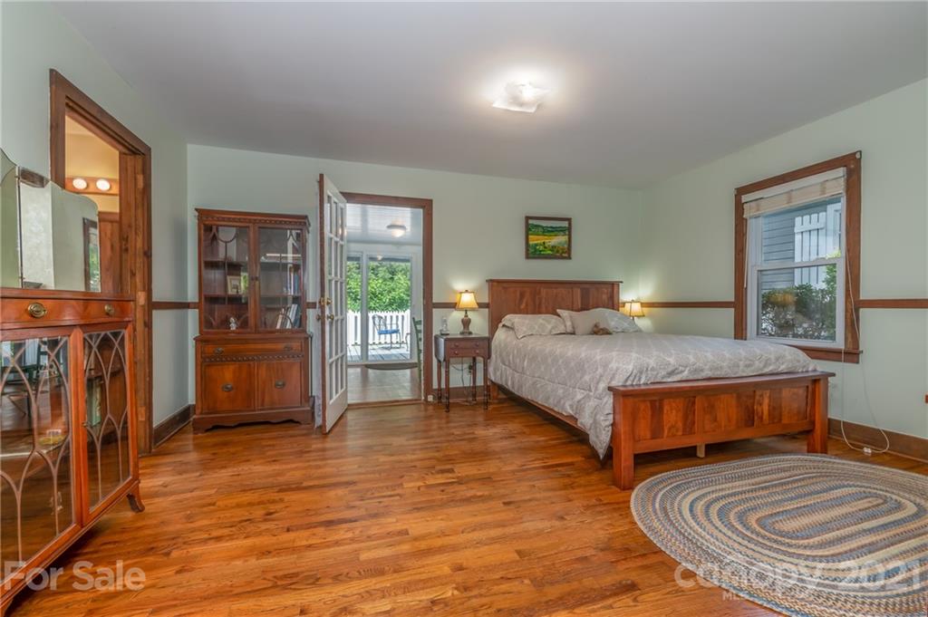 75 Hidden Hill Road Tryon, NC 28782 - Photo 27 of 36 a bedroom with a bed and window