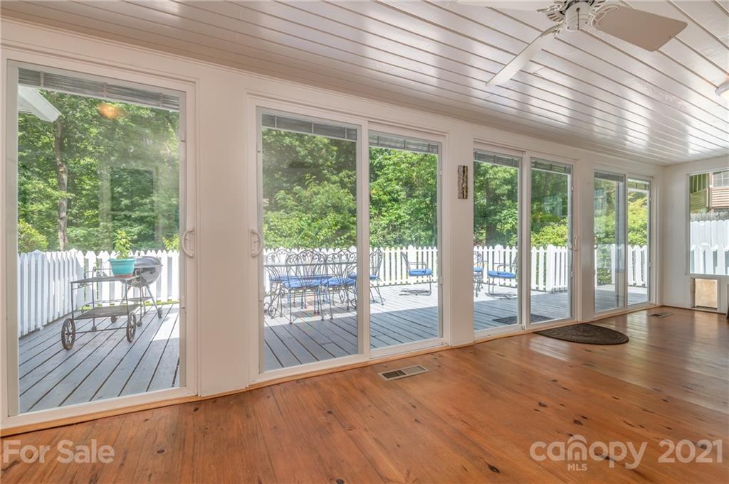 75 Hidden Hill Road Tryon, NC 28782 - Photo 32 of 36 a view of a room with wooden floor and windows