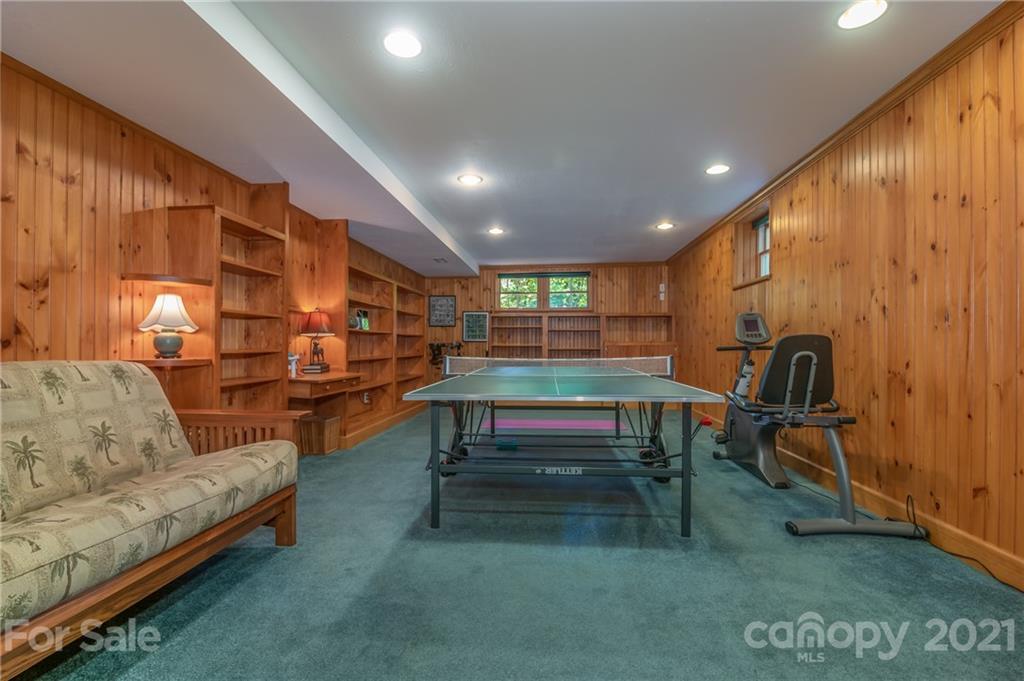 75 Hidden Hill Road Tryon, NC 28782 - Photo 33 of 36 a living room with furniture a rug and white walls